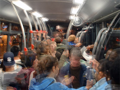 stylized image of the interior of a crowded AC Transit buss