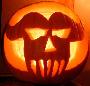 a jack o lantern cut out in the shape of the danzig skull