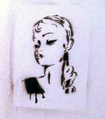 a stencil art piece of a sexy girls face... black paint on a fresh white wall
