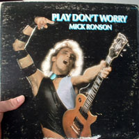 an image of a dorky british 80s guy Mick Ronson playing guitar on the cover of his album play dont worry
