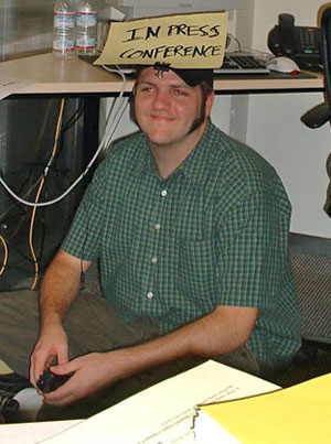joe with sign on head