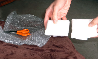 michelle making laptop wrist rests out of bubble wrap and tissues