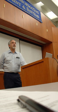 Image of Mitch Kapor at the podium speaking at SIMS